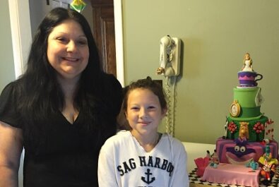 woman and girl with a custom cake
