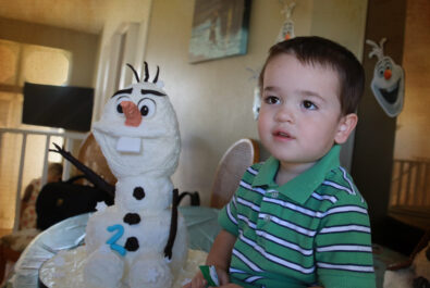 boy with an olaf cake