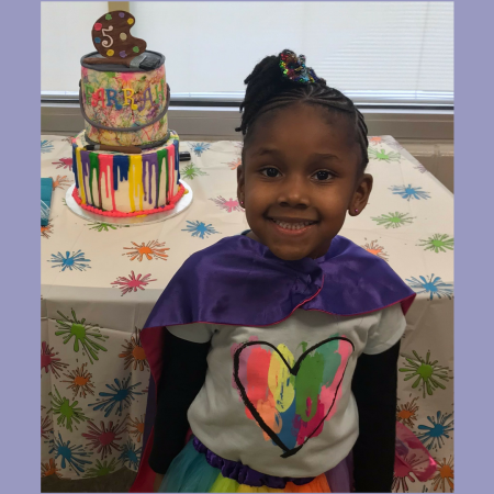 girl with a painters cake