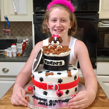 Haley posing with a cake