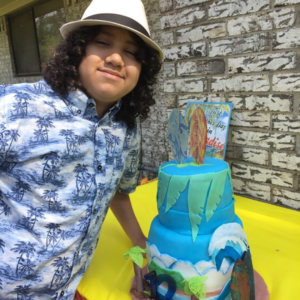 Leonardo posing with a cake