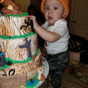 Levi with a big cake
