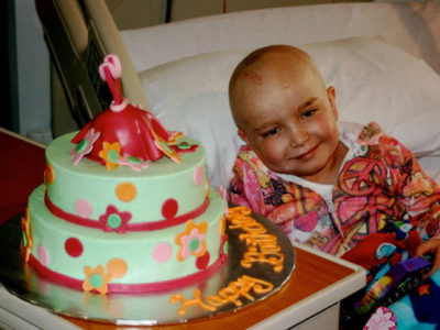 kid in a hospital bed celebrating their 10th birthday