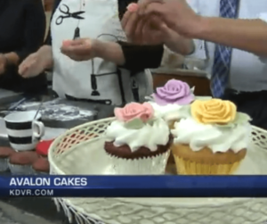 table with a plate of cupcakes