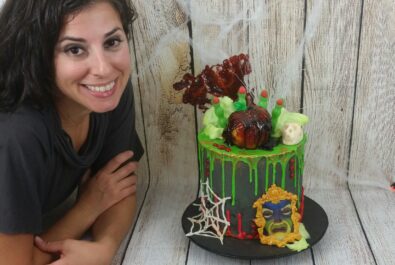 woman next to a snow white cake