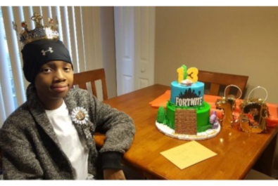 boy with a fortnite cake
