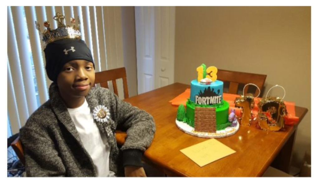 boy with a fortnite cake