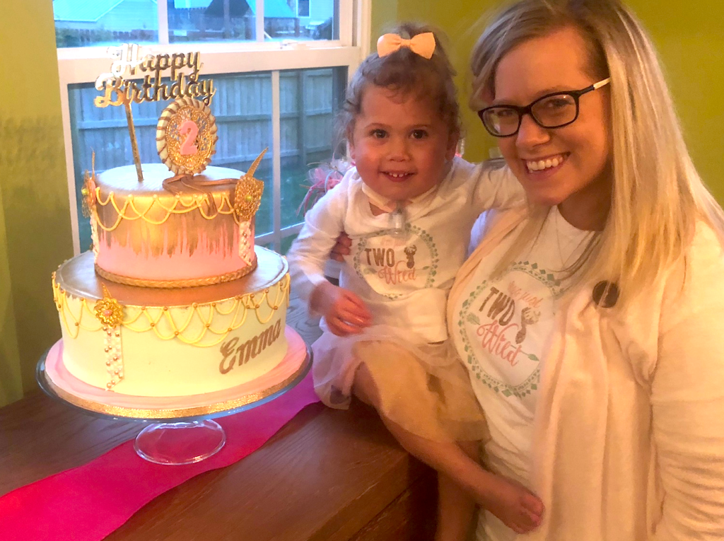 girl and mother with a custom cake
