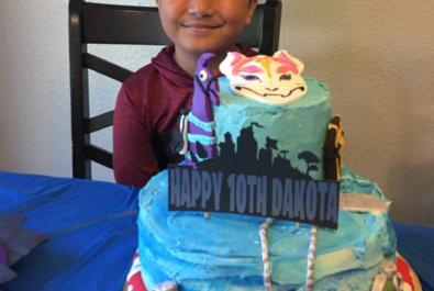 boy with a fortnite cake