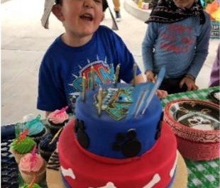 boy with a custom cake