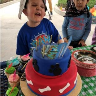 boy with a custom cake