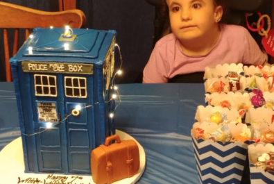 kid with a dr who cake