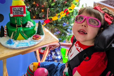 kid with an elf cake