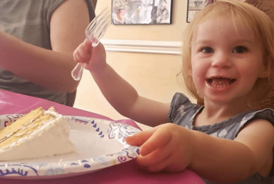 girl with a slice of cake