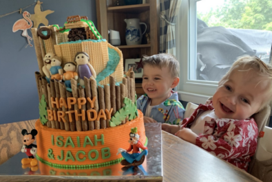 kids with a disney cake