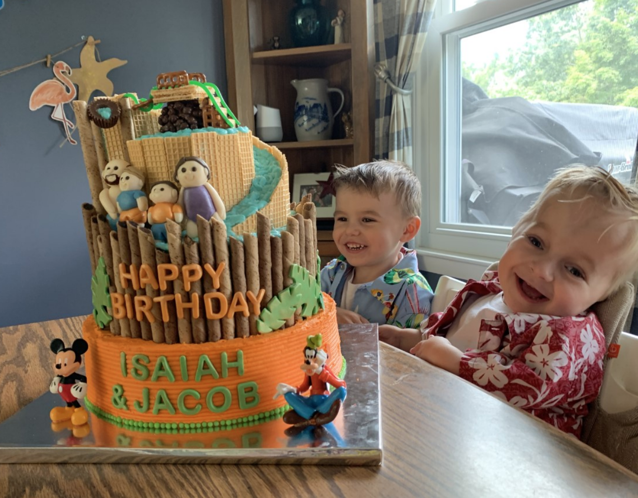 kids with a disney cake