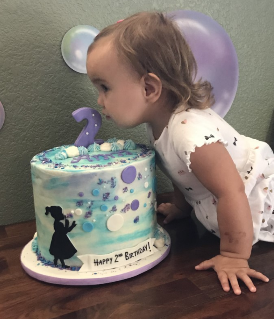A cake so pretty, Anna just had to give it a kiss!