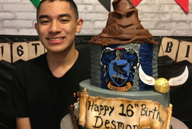 boy with a harry potter cake