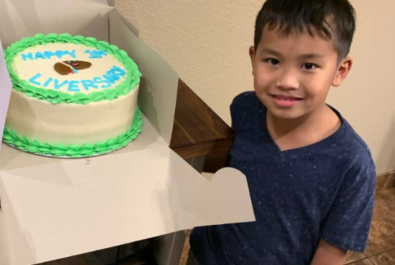 boy with a custom cake