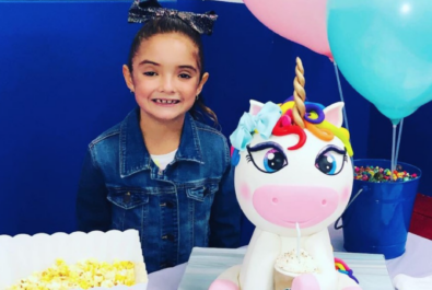 girl with a unicorn cake