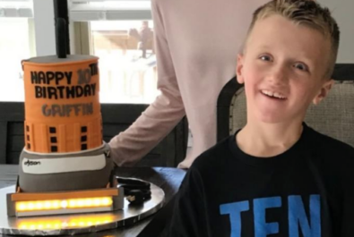 son and mother with a vacuum cake