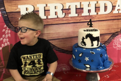 boy with a custom cake