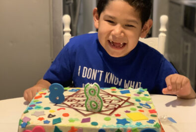 boy with a custom cake