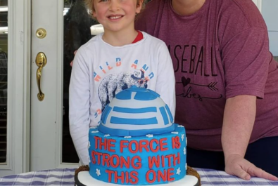 boy and mother with a star wars cake
