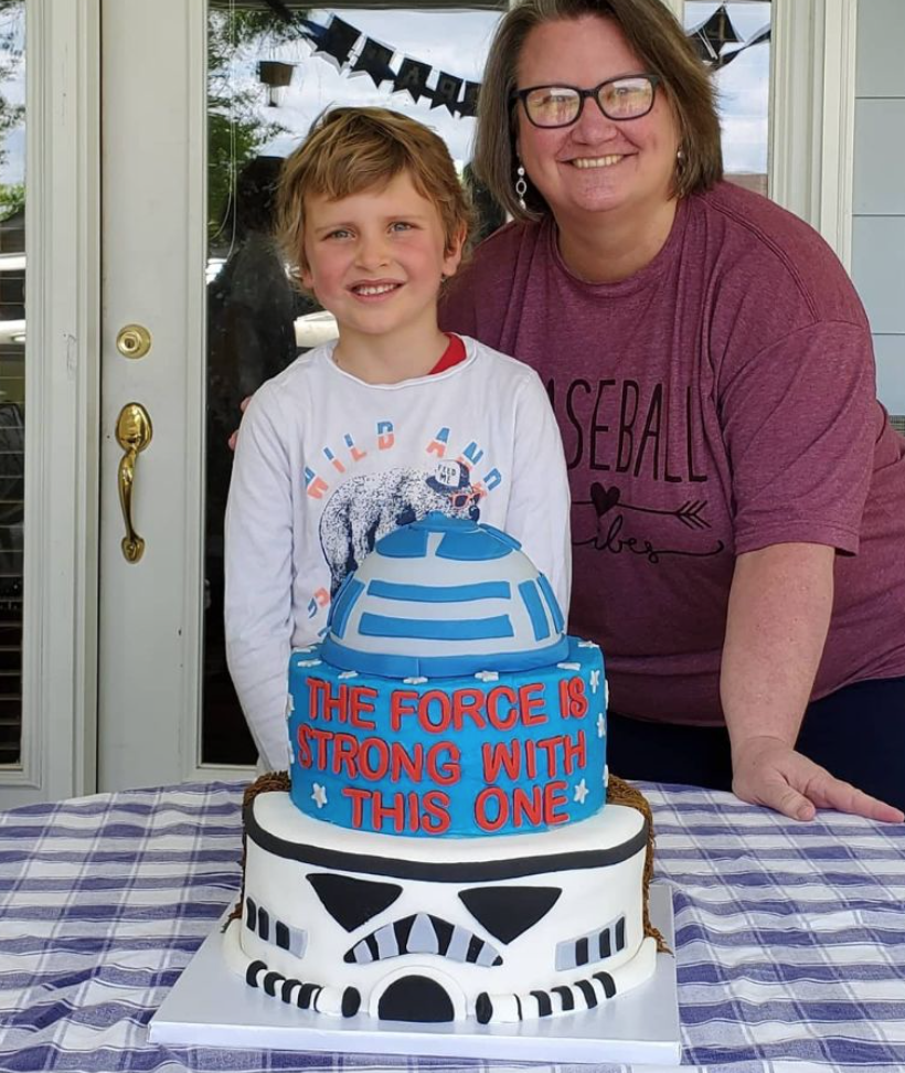 boy and mother with a star wars cake