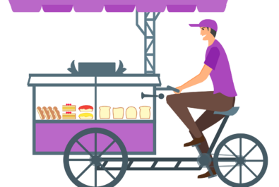 guy driving a small food cart